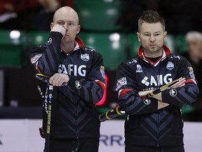 Skip Mike McEwen (right) and third B.J. Neufeld look less than impressed during the 2016 Manitoba men’s curling championship in Selkirk on Thursday but they pulled out a win over Brandon’s Terry McNamee.