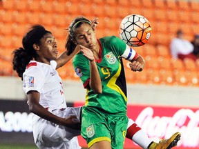 Canada's Ashley Lawrence (left) and Guyana's Ashley Rodrigues go after the ball during the second half of a CONCACAF Olympic qualifying tournament match in Houston on Thursday, Feb. 11, 2016. (Pat Sullivan/AP Photo)
