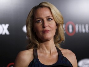 Cast member Gillian Anderson poses at a premiere for "The X-Files" at California Science Center in Los Angeles, California January 12, 2016. A 6-episode series premieres on January 24.  REUTERS/Mario Anzuoni