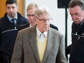 Reinhold Hanning, a 94-year-old former guard at Auschwitz, arrives in the courtroom before his trial in Detmold, Germany, on Feb. 12, 2016. Hanning is accused of being an accessory to the murder of at least 170,000 people - the first of four such court cases that could be the last due to the very advanced age of the defendants. (REUTERS/Bernd Thissen/Pool)