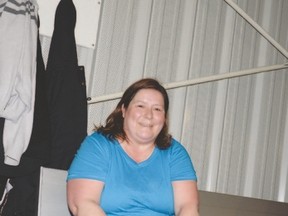 Candace Cooper laces up her shoes as she gets ready for her regular walk at the TransAlta Tri-Leisure Centre. She is preparing for the OneWalk in Calgary on June 25. - Photo by Marcia Love