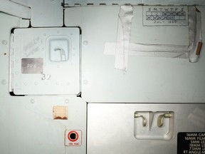 This image provided by the Smithsonian Institution shows part of the interior of the Apollo 11 command module that shows graffiti left by astronauts Neil Armstrong, Buzz Aldrin and Michael Collins. A calendar hand drawn on the wall marking days in space and scribbled warning instructions to not open certain doors are some of the things the public will be able to see as part of a new, 3D look inside the spacecraft that took astronauts on America's historic 1969 mission to the moon. (Smithsonian Institution via AP)
