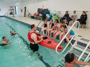 Dwain Forrest, owner of Timber's Outfitters teaches the Girl Guides some useful tips at the Vanastra Recreation Centre. (Contributed photo)