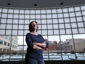 Anouk Hoedeman, coordinator of Safe Wings Ottawa, poses for a photo at Ottawa City Hall in Ottawa Thursday Feb 11, 2016. More and more birds are dying in Ottawa due to glass structures including the glass wall at Ottawa City Hall.  (Tony Caldwell/Postmedia Network)