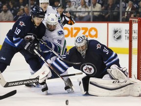 Ondrej Pavelec has been cleared to return to the Jets lineup. (Bruce Fedyck-USA TODAY Sports file photo)