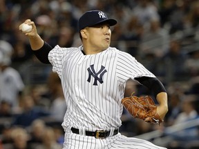 In this Tuesday, Oct. 6, 2015 file photo, New York Yankees pitcher Masahiro Tanaka delivers against the Houston Astros during the American League wildcard game in New York. (AP Photo/Julie Jacobson, File)