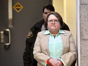 In a Tuesday, March 10, 2015 file photo, Joyce Hardin Garrard walks to the Etowah County Judicial Building from the Etowah County Detention Center in Gadsden, Ala.  Garrad, serving life without parole in her granddaughter, 9-year-old Savannah Hardin's running death, died Friday, Feb. 12, 2016, five days after being stricken at the state’s women’s prison, according to a prison spokesman. (AP Photo/AL.com, Frank Couch, File)