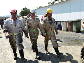 Search and rescue team members at the Lily Gold Mine near Barberton, South Africa, Saturday Feb. 13, 2016. (AP Photo)