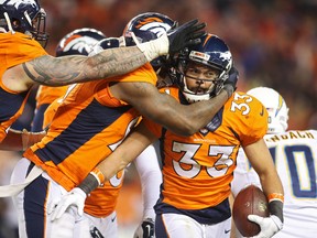 Denver Broncos defensive back Shiloh Keo celebrates with teammates after intercepting a pass during the second half against the San Diego Chargers at Sports Authority Field at Mile High in Denver on Jan. 3, 2016. (Chris Humphreys/USA TODAY Sports)