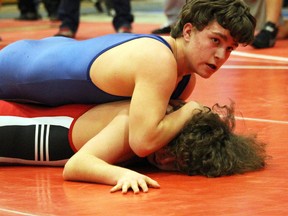 Justin Bresett of St. Clair holds down Northern's Bernie Mockler during a 64-kg boy's wrestling match at the Lambton Kent high school championships at Sarnia Collegiate on Thursday, Feb. 11, 2016 in Sarnia, Ont. St. Clair won the boy's and overall team titles. Terry Bridge/Sarnia Observer/Postmedia Network