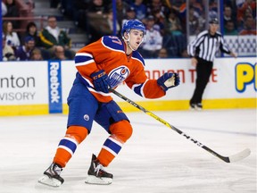 Connor McDavid (97) of the Edmonton Oilers goes up against the Toronto Maple Leafs at Rexall Place in Edmonton, Alta. on Feb. 11, 2016.