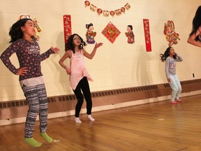 A quartet of child dancers practice their performance Saturday afternoon for the evening's Lambton Chinese Canadian Association Chinese New Year celebration. From left are Cynthia Zhang, Cheryl Li, Lin Core, and Hannah Yao. Tyler Kula/Sarnia Observer/Postmedia Network
