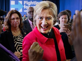 Democratic presidential candidate Hillary Clinton reacts to a greeting from a child in the crowd after speaking during a town hall meeting at Denmark Olar Elementary School in Denmark, S.C., Friday Feb. 12, 2016. (AP Photo/Jacquelyn Martin)
