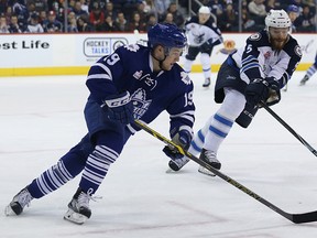 Toronto Marlies forward Brendan Leipsic, left, chases a loose puck in Winnipeg on Feb. 6, 2016. (Kevin King/Winnipeg Sun/Postmedia Network)