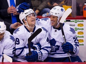 Toronto Maple Leafs' Brendan Leipsic celebrates his first career NHL goal with teammate Rich Clune during third period NHL hockey action against the Vancouver Canucks on Saturday February 13, 2016. (THE CANADIAN PRESS/Ben Nelms)
