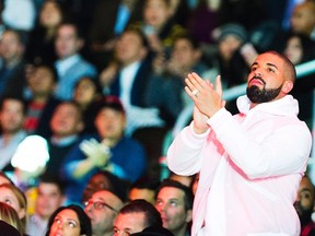 Rapper Drake watches the NBA all-star skills competition from court side in Toronto on Saturday, February 13, 2016. (THE CANADIAN PRESS/Mark Blinch)