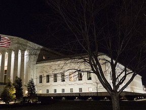 A U.S. flag flies at half-staff in front of the U.S. Supreme Court in Washington Saturday, Feb 13, 2016, after is was announced that Supreme Court Justice Antonin Scalia, 79, had died. (AP Photo/J. David Ake)