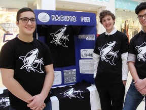Joseph Iaccino, left, Keegan Van Gaver, and Taslim Shamalisham are some of the students running Pacific Fin, one of two high school student-run companies in this year's Junior Achievement Company Program. The students were showing off their business model at Lambton Mall Saturday. Tyler Kula/Sarnia Observer/Postmedia Network