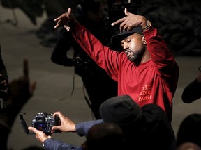 Kanye West dances during his Yeezy Season 3 Collection presentation and listening party for the "The Life of Pablo" album during New York Fashion Week Feb. 11, 2016. REUTERS/Andrew Kelly