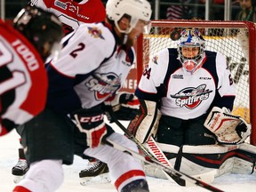 Ottawa 67s' Nathan Todd (81) shoots on Windsor Spitfires' goalie, Michael Depietro (64) during the first period of OHL action at TD Place Arena Sunday February 14, 2016. (Darren Brown)