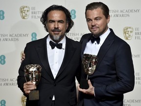 Best director Alejandro Inarritu and best leading actor Leonardo DiCaprio (R) hold their awards at the British Academy of Film and Television Arts (BAFTA) Awards at the Royal Opera House in London, February 14, 2016. REUTERS/Toby Melville