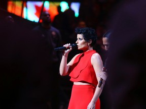 Nelly Furtado sings the Canadian National Anthem during the NBA All-Star Game at the Air Canada Centre in Toronto, Ont. on Sunday February 14, 2016. Dave Abel/Toronto Sun/Postmedia Network
