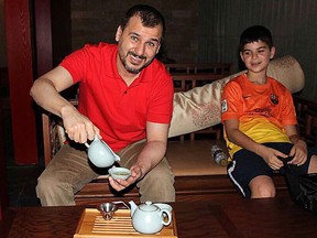 Canadian Salim Alaradi and his son, Mohamed Alaradi are shown on a family vacation in the United Arab Emirates in a 2013 family handout photo. THE CANADIAN PRESS/HO