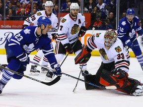 Shawn Matthias of the Toronto Maple Leafs gets stopped by Scott Darling of the Chicago Blackhawks during NHL action at the Air Canada Centre in Toronto on Jan. 15, 2016. (Dave Abel/Toronto Sun)