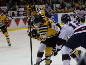 Sarnia Sting forward Matt Mistele splits two Saginaw Spirit defenders during the Ontario Hockey League game at the Sarnia Sports and Entertainment Centre on Monday, Feb. 15, 2016 in Sarnia, Ont. Mistele scored two first-period goals as his club jumped out to an early 5-0 lead, then completed the hat trick in the second period. (Terry Bridge, The Observer)