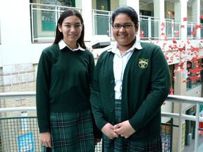 Grade 11 students Mary McKeigan (left) and Fariba Ishrar are working together to further awareness of Indigenous issues, as 1,017 butterflies float in Balmoral Hall School's atrium in memory of murdered Aboriginal women in Canada.