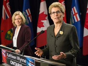 Ontario Premier Kathleen Wynne, right, and Alberta Premier Rachel Notley take part in a joint press conference following their meeting at the Queens Park Legislature, in Toronto, on Friday, Jan. 22, 2016. THE CANADIAN PRESS/Chris Young