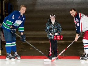 Jonathan Pitre was a special guest at the civic complex, performing opening ceremonial faceoff duties, along with Hawkesbury's Brett Everson (left) and Colts captain Lawson MacDonald, on Monday February 15, 2016 in Cornwall, Ont. Robert Lefebvre/Special to the Cornwall Standard-Freeholder/Postmedia Network