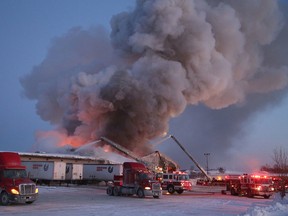 John Lappa/Sudbury Star
Billowing smoke was visible from miles away as firefighters battled a major blaze at Gardewine in the Walden Industrial Park on Saturday.