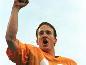 Tennessee Volunteers quarterback Peyton Manning celebrates his teams' victory over Vanderbilt in Knoxville, Tenn., in this file photo taken Nov. 29, 1997. Manning's reputation as the NFL's most bankable player took a hit when he was among 10 athletes cited in a lawsuit filed by six former female students against the University of Tennessee. (Tami Chappell/Reuters/Files)