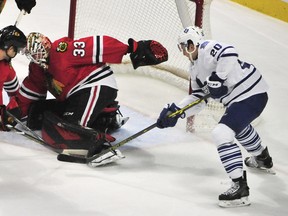 Blackhawks goalie Scott Darling makes a save on Maple Leafs' Frank Corrado during Monday's game in Chicago. (USA TODAY SPORTS/PHOTO)