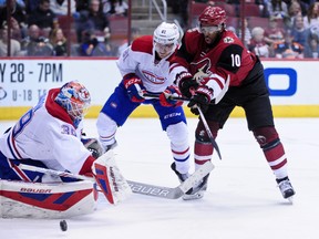 Coyotes left wing Anthony Duclair (10) shoots on Canadiens goalie Mike Condon (39) as Canadiens centre Lars Eller (81) defends during second period NHL action at Gila River Arena Glendale, Ariz., on Monday, Feb 15, 2016. (Matt Kartozian/USA TODAY Sports)