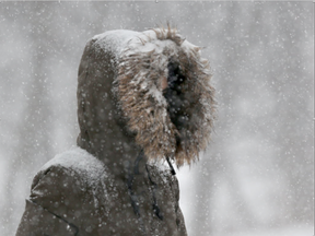 A snow storm caused problems for drivers and pedestrians Tuesday morning. (Tony Caldwell/Postmedia)