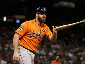Evan Gattis of the Houston Astros flips his bat after being hit by a pitch during a game against the Arizona Diamondbacks at Chase Field on October 3, 2015 in Phoenix. (Christian Petersen/Getty Images/AFP)