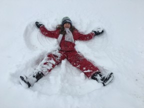 Bruce Bell/The Intelligencer
Vanessa Lavender, 10,enjoys an extra long weekend, making a snow angel on the front yard of her Wellington home. She joined thousands of Quinte region students enjoying a snow day.