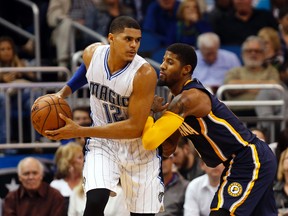 Indiana Pacers forward Paul George (right) defends against Orlando Magic forward Tobias Harris at Amway Center. (Kim Klement/USA TODAY Sports)