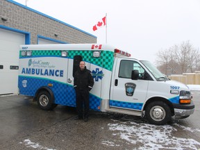 Acting manager of Oxford County Paramedic Services Stephen Turner shows off the new design for ambulances and other vehicles in the paramedic fleet. The checkerboard pattern - known as the Battenburg design - is highly reflective and will make ambulances more visible to drivers. (MEGAN STACEY/Sentinel-Review)