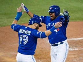 Blue Jays' Jose Bautista (left) and Edwin Encarnacion (right) both have one year remaining on their contracts before becoming eligible for free agency. (Darren Calabrese/The Canadian Press)