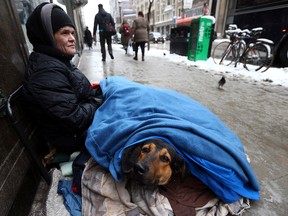 Homeless woman Heather Markle with her dog Lucky on College St. near Yonge St. on Tuesday, February 16, 2016. (Dave Abel/Toronto Sun)