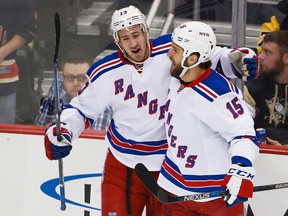 Rangers forward Kevin Hayes (left) celebrates his goal with teammate Tanner Glass (right) against the Penguins during NHL action in Pittsburgh on Wednesday, Feb. 10, 2016. (Gene J. Puskar/AP Photo)
