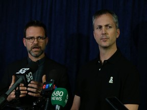 Tim Maguire (middle) president of Local 79 and Matt Elloway bargaining unit member for Local 416, speak to the media at City Hall about labour issues February 12, 2016. (Jack Boland/Toronto Sun)