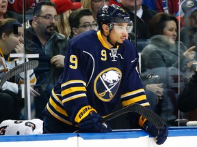 Buffalo Sabres left wing Evander Kane (9) watches from the bench.