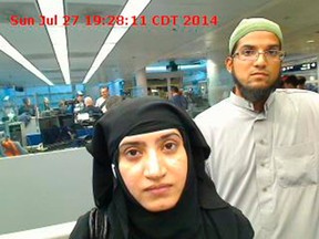 Tashfeen Malik, (L), and Syed Farook are pictured passing through Chicago's O'Hare International Airport in this July 27, 2014 handout photo obtained by Reuters December 8, 2015. Federal and local law enforcement officials on January 6, 2016, asked for the public's help in piecing together the movements of a married couple in the hours after they killed 14 people at a county office building in San Bernardino, California. REUTERS/US Customs and Border Protection/Handout via Reuters