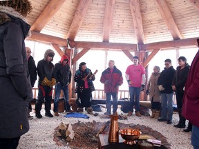 Participants take part in a ceremony to honour missing and murdered Aboriginal women at Cambrian College's Sacred Fire Arbour in Sudbury, Ont. on Tuesday February 16, 2016. The event was hosted by Cambrian College's Wabnode Centre for Aboriginal Services. Gino Donato/Sudbury Star/Postmedia Network