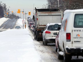 Traffic is snarled on Riverside Dr. as Ottawa digs out from 50 cms of snow Wednesday February 17, 2016. (Darren Brown. Assignment 122921