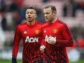 Manchester United's Wayne Rooney (R). (Reuters)